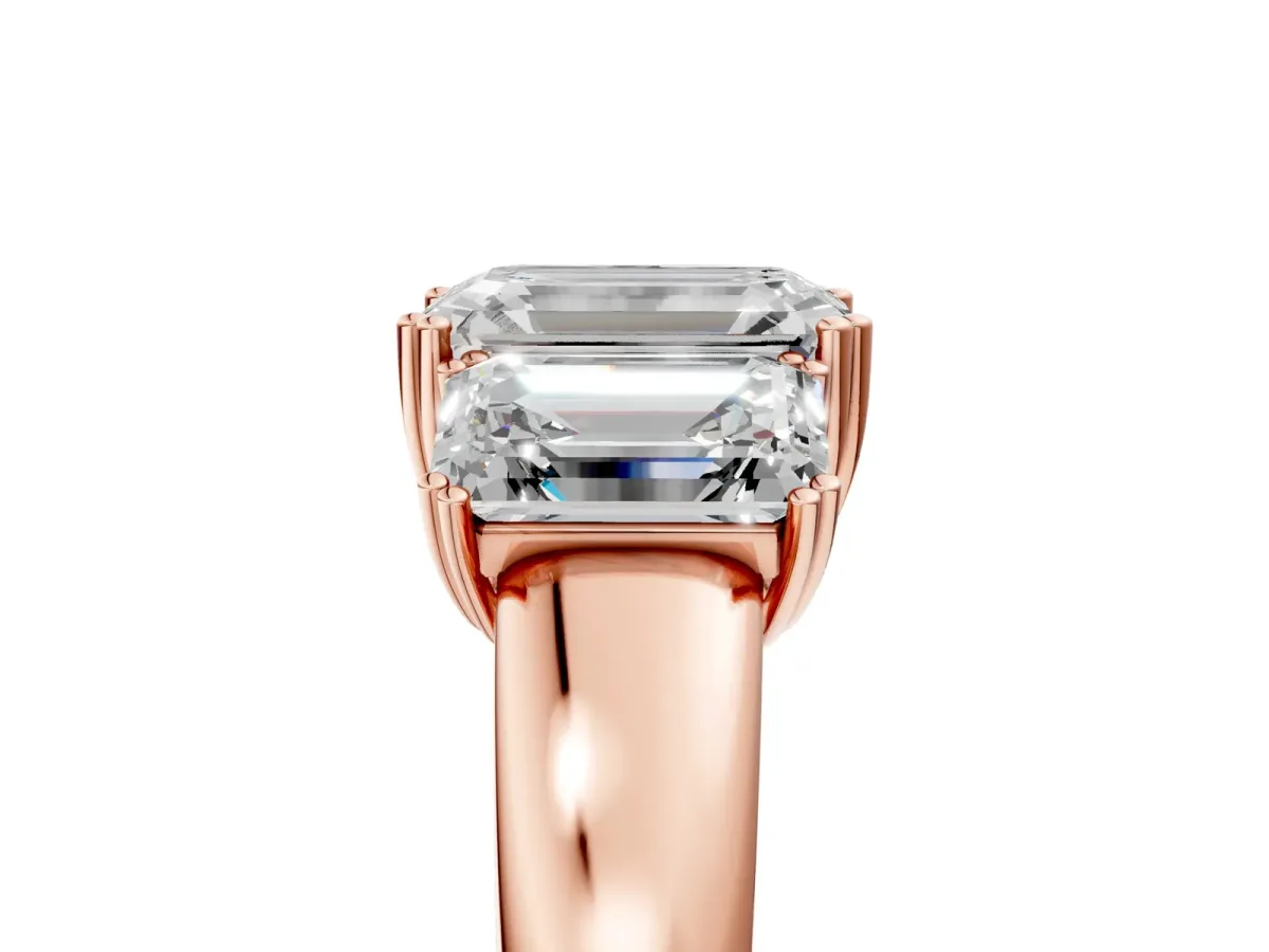 Three-Stone Emerald Cut Cut Diamond Ring with Channel Set Band and Four-Prong Setting Rose gold
