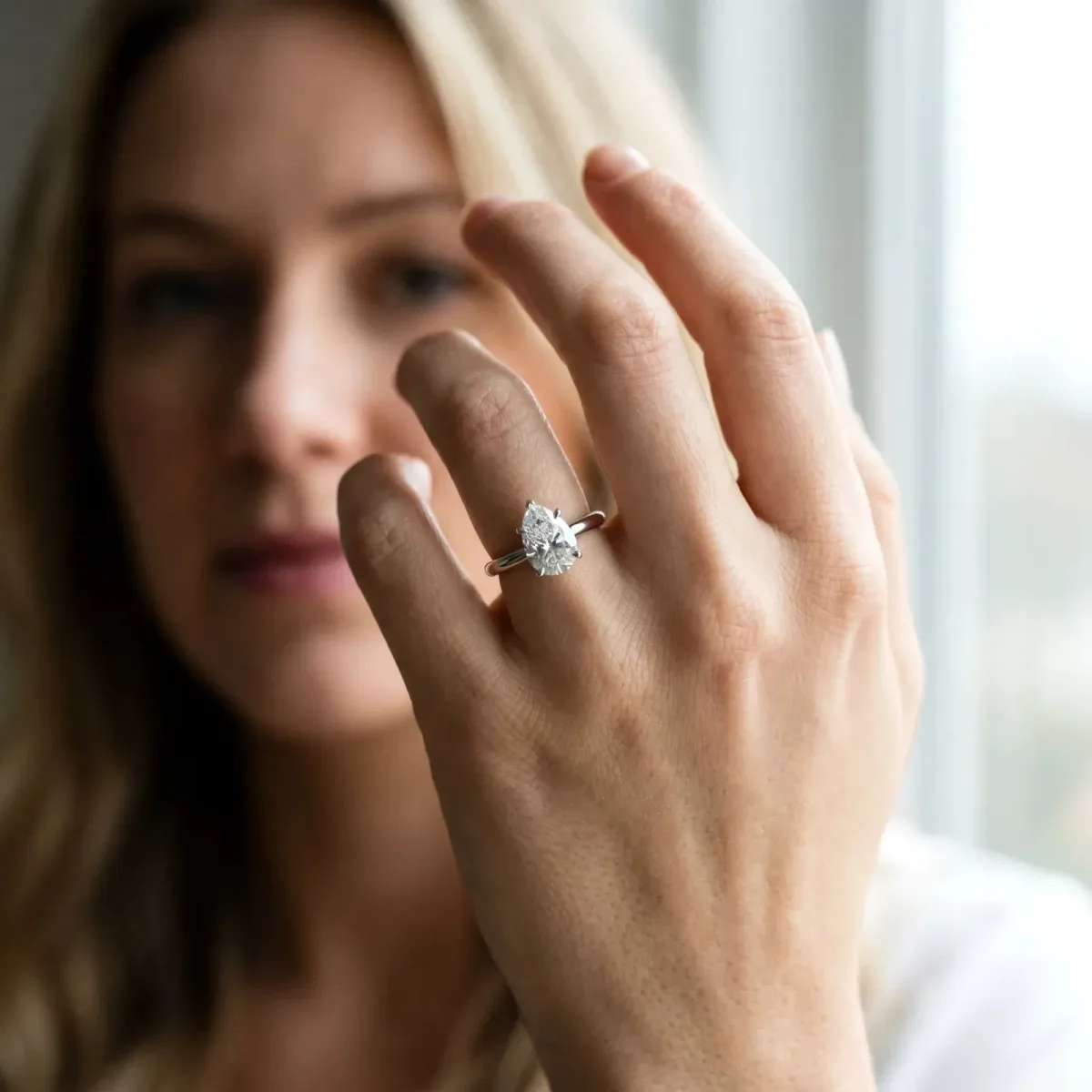 Pear Cut Diamond Solitaire Engagement Ring with Classic Band and Four-Prong Setting Silver