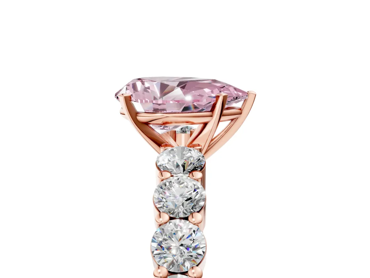 Fancy Pink Pear Cut Diamond Solitaire Ring with Shared Prong Round Side Stones Rose gold