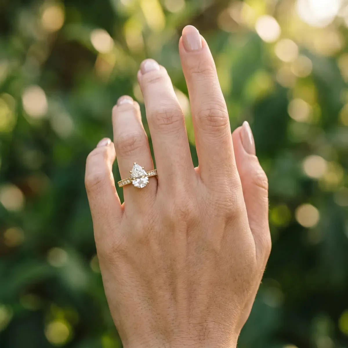 Pear Cut Solitaire with Pavé Band and Four-Prong Setting Yellow gold