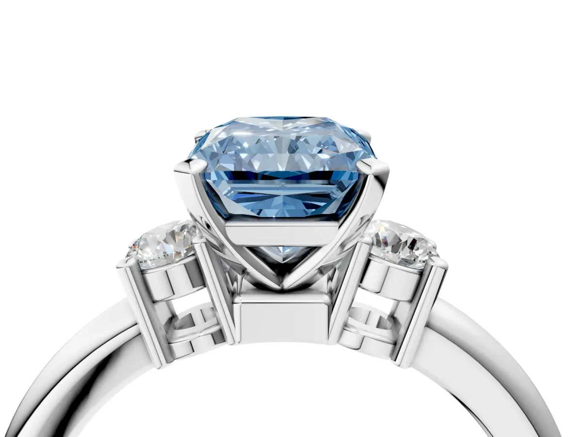Fancy Blue Three-Stone Radiant Cut Cut Diamond Solitaire with Prong Setting and Classic Band Platinum