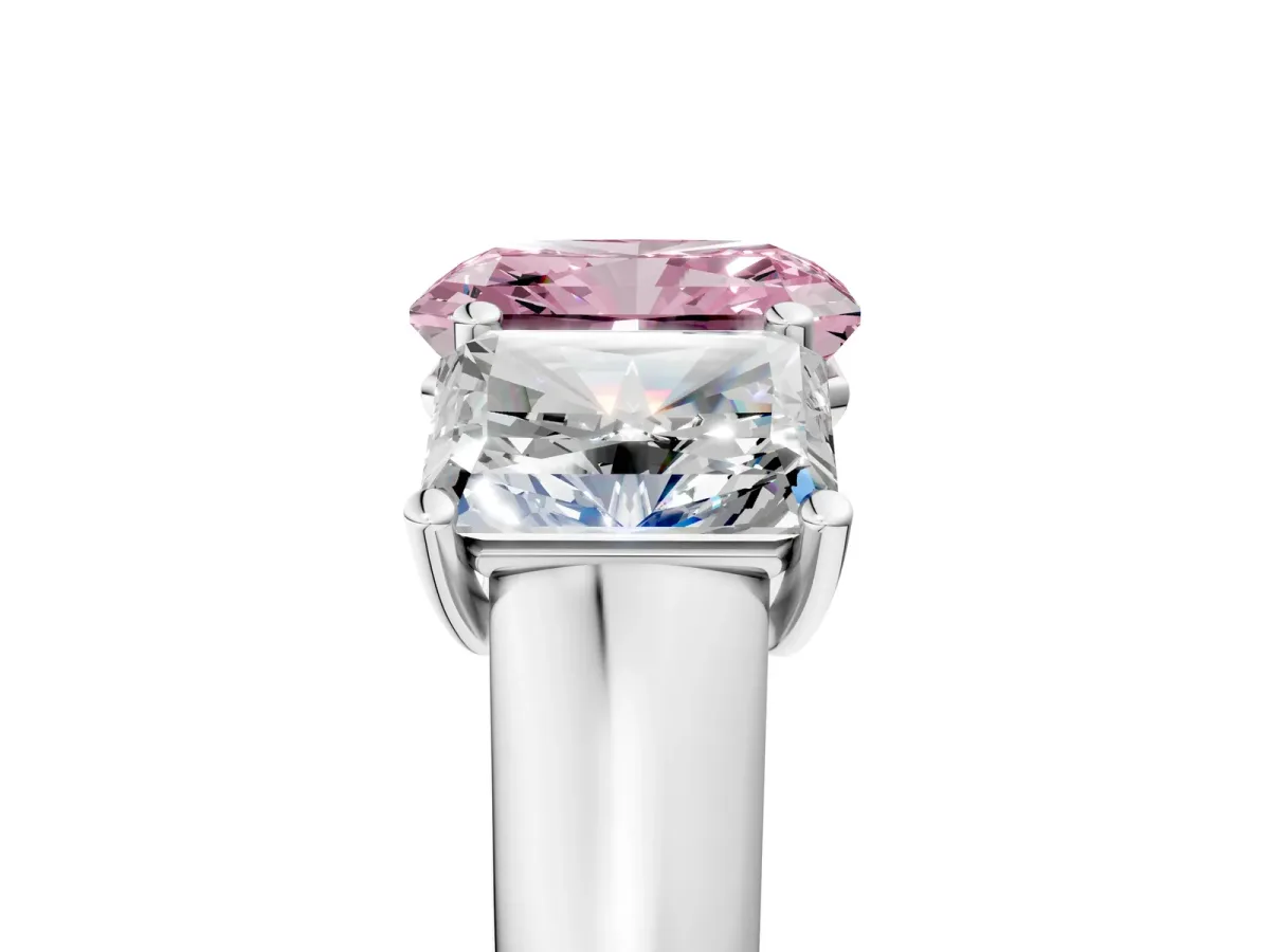 Fancy Pink Radiant Cut Three-Stone Diamond Ring with Prong Setting on a Classic Band Platinum