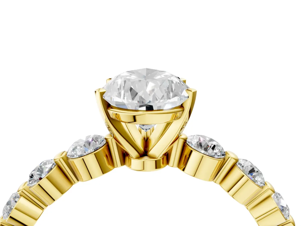 Pear Cut Solitaire Diamond Ring with Pave Band and Four-Prong Setting Yellow gold