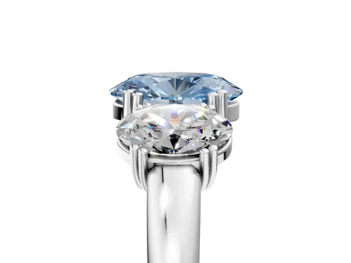 Fancy Blue Three-Stone Oval Cut Cut Diamond Ring with Channel Set Band and Four-Prong Setting Platinum