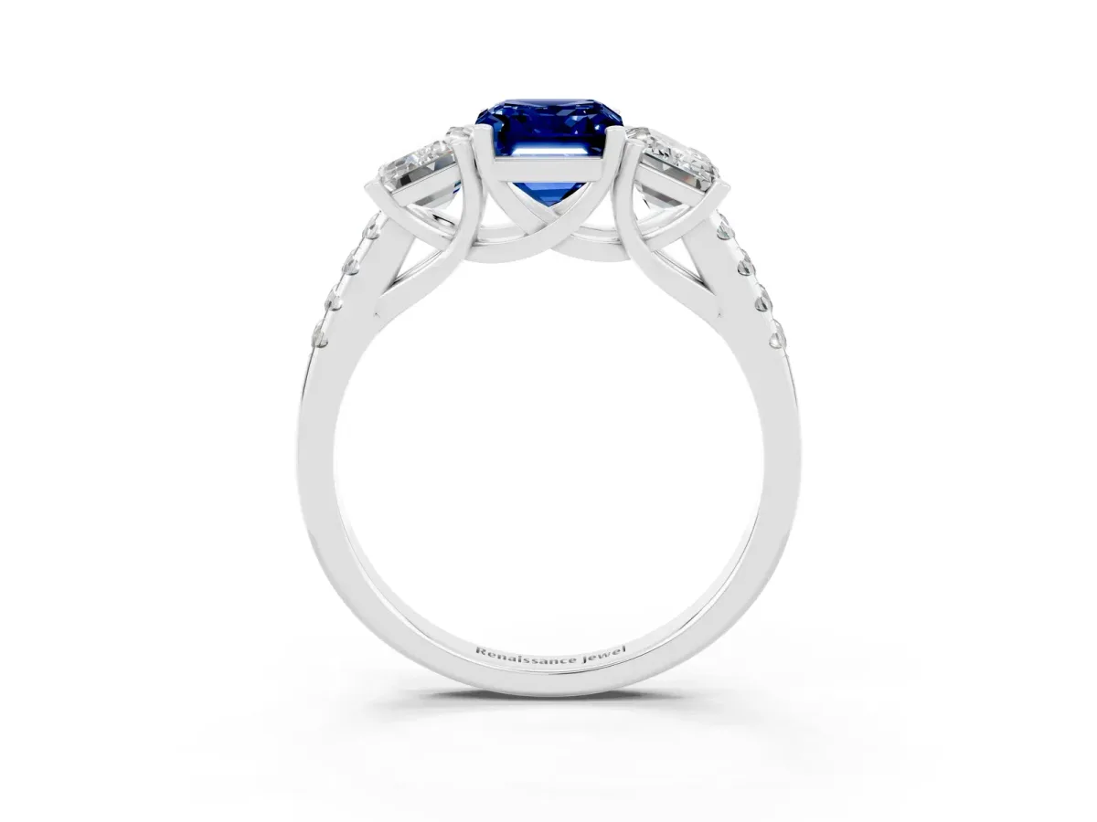 Three-Stone Emerald Cut Blue Sapphire Ring with Round Pavé Band and Prong Setting Platinum