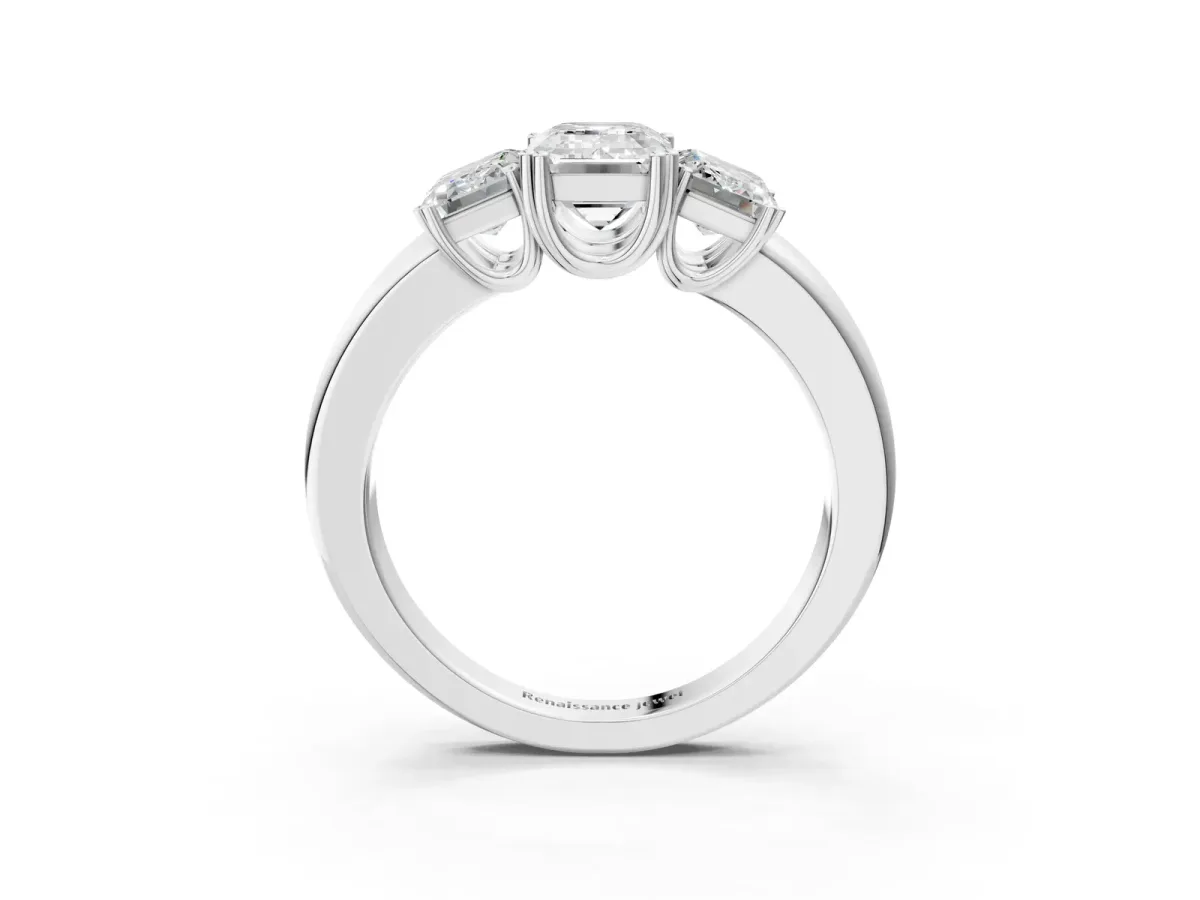 Three-Stone Emerald Cut Cut Diamond Ring with Channel Set Band and Four-Prong Setting White gold