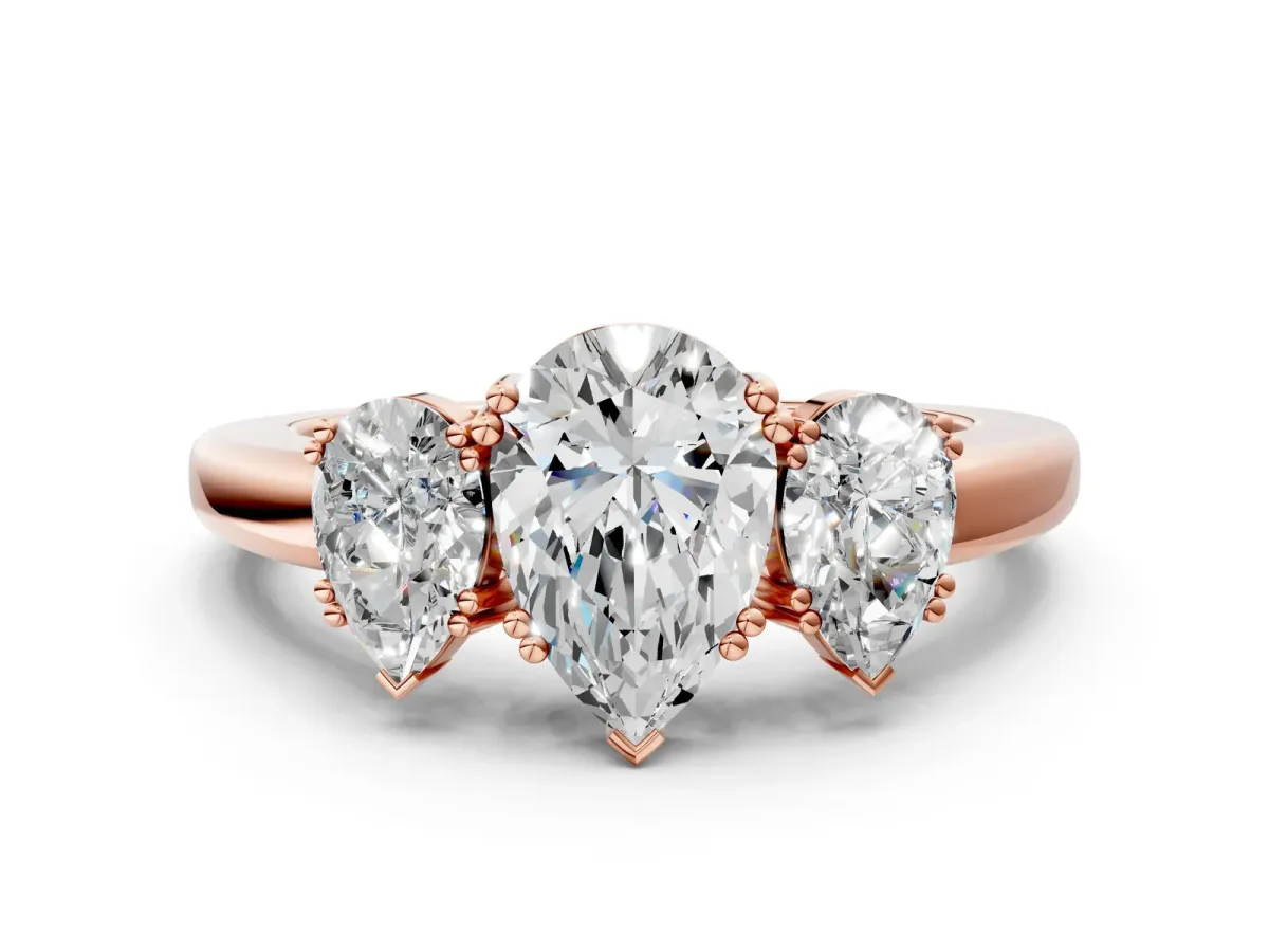 Three-Stone Pear Cut Cut Diamond Ring with Channel Set Band and Four-Prong Setting Rose gold