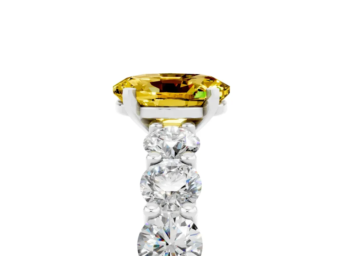 Oval Cut Yellow Sapphire Prong Setting with Side Stones on a Pave Band Platinum