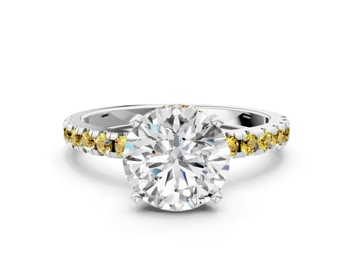 Round Cut Diamond Solitaire Ring with Round Tanzanite Pavé Band and Four-Prong Setting Silver
