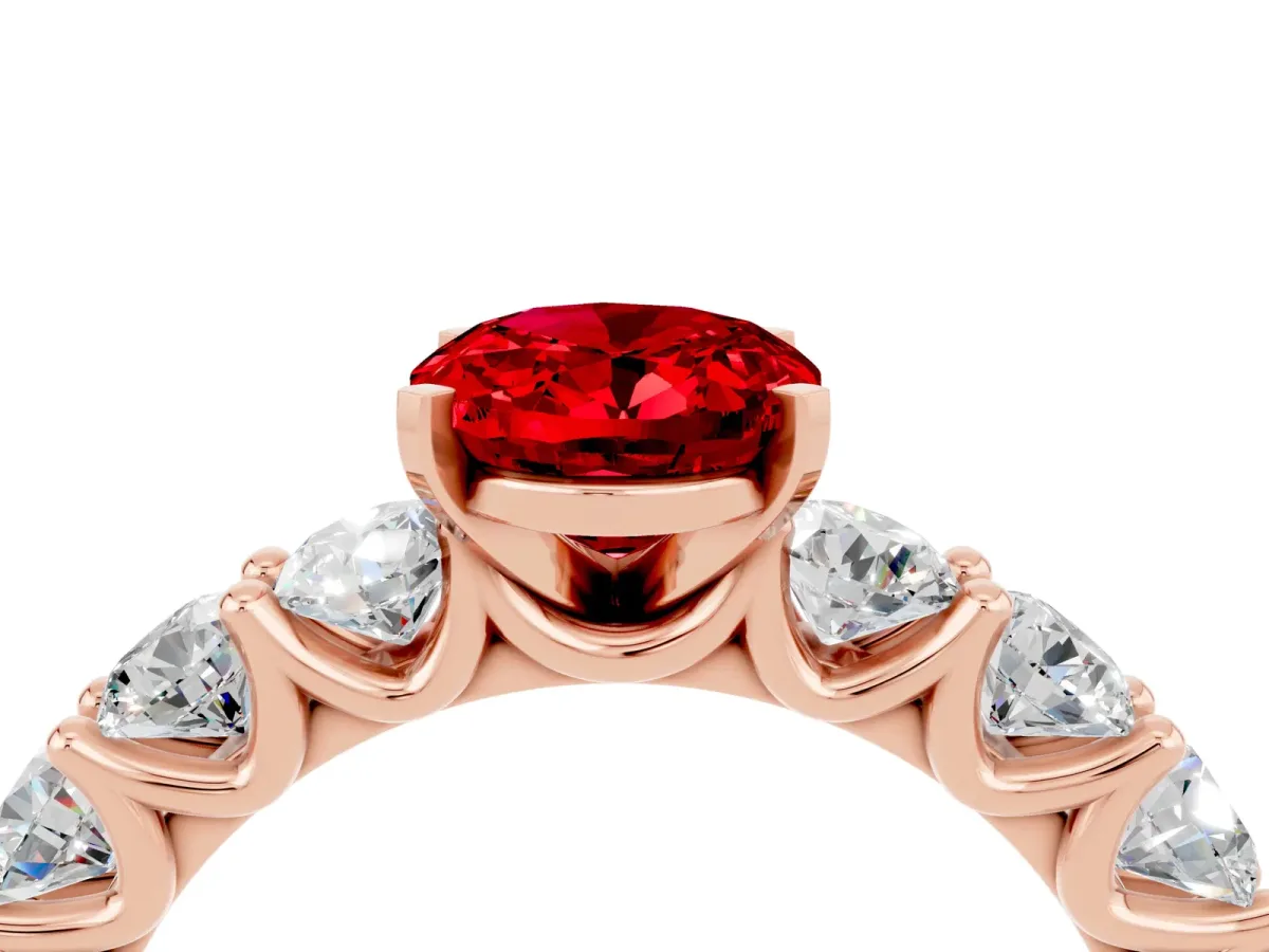 Oval Cut Ruby Prong Setting with Side Stones on a Pave Band Rose gold