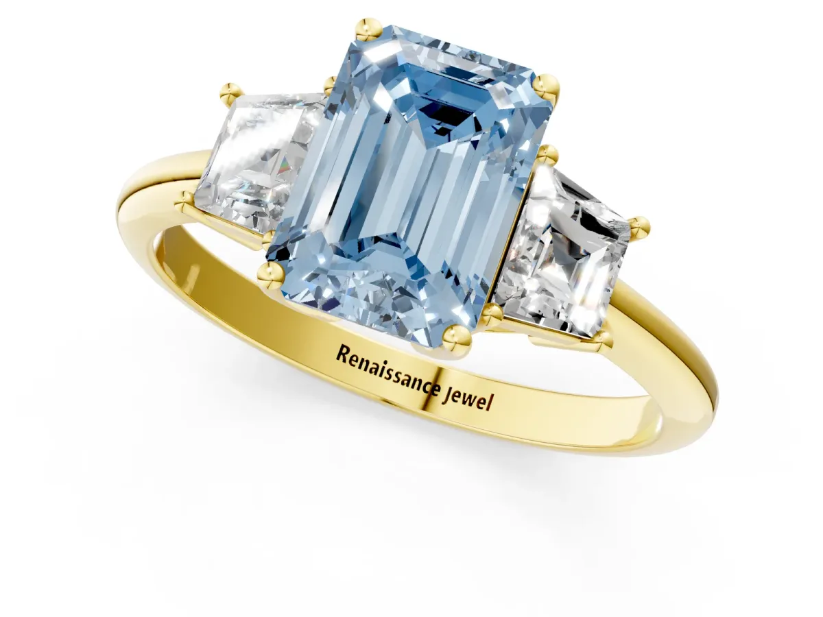 Fancy Blue Emerald Cut Diamond Three-Stone Ring with Trapezoid Side Stones and Prong Setting Yellow gold