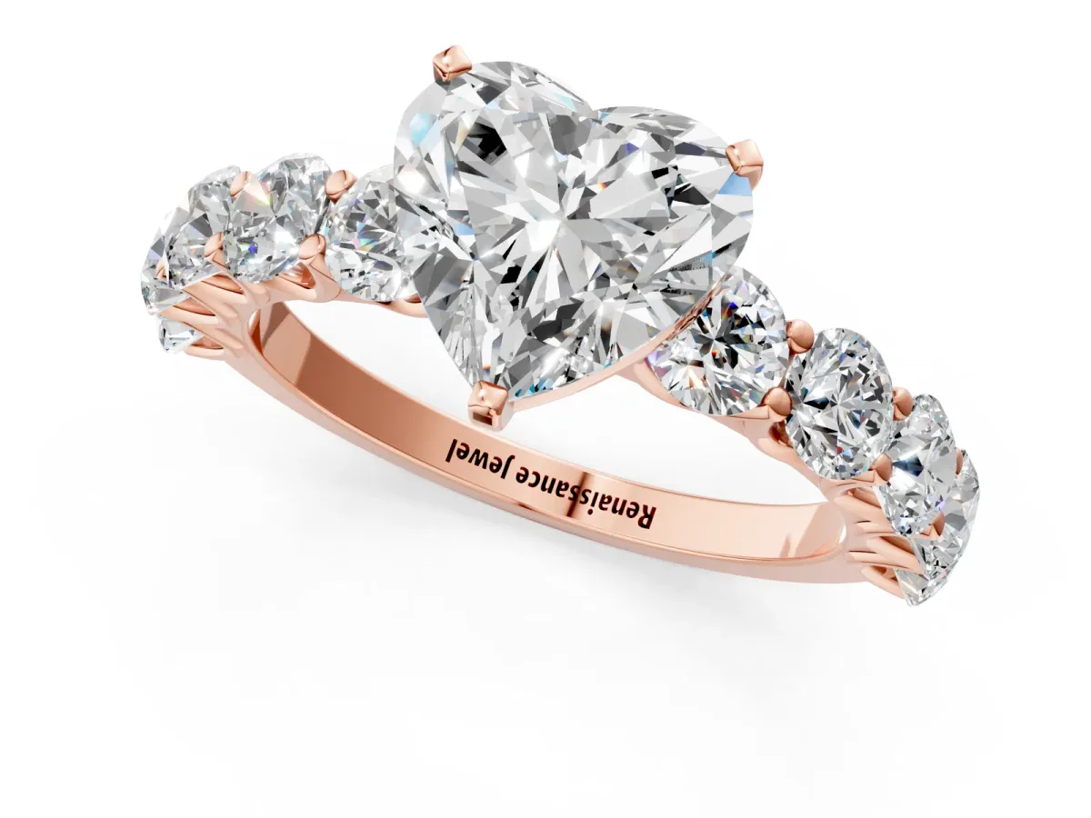 Heart Cut Diamond Prong Setting with Side Stones on a Pave Band Rose gold