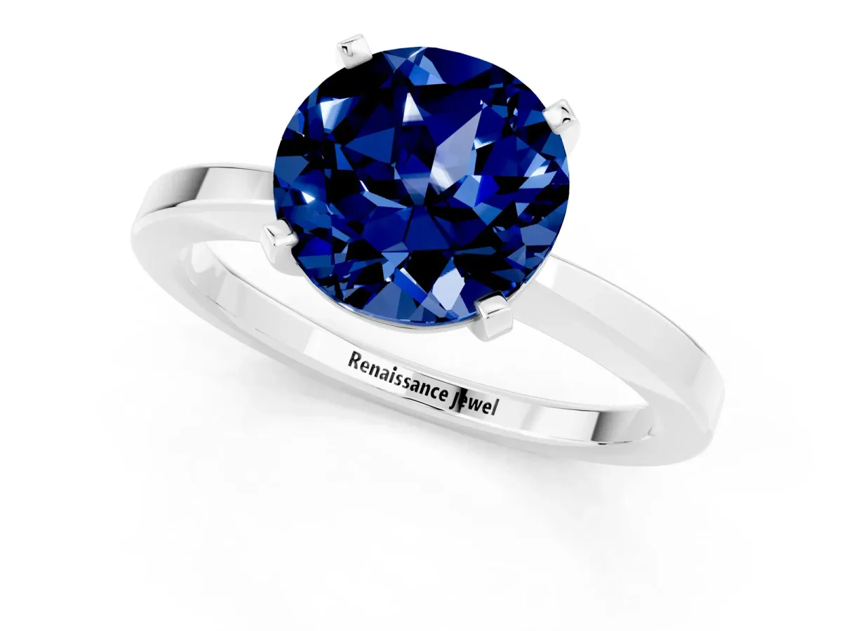 Round Cut Blue Sapphire Solitaire Engagement Ring with Classic Band and Four-Prong Setting Silver
