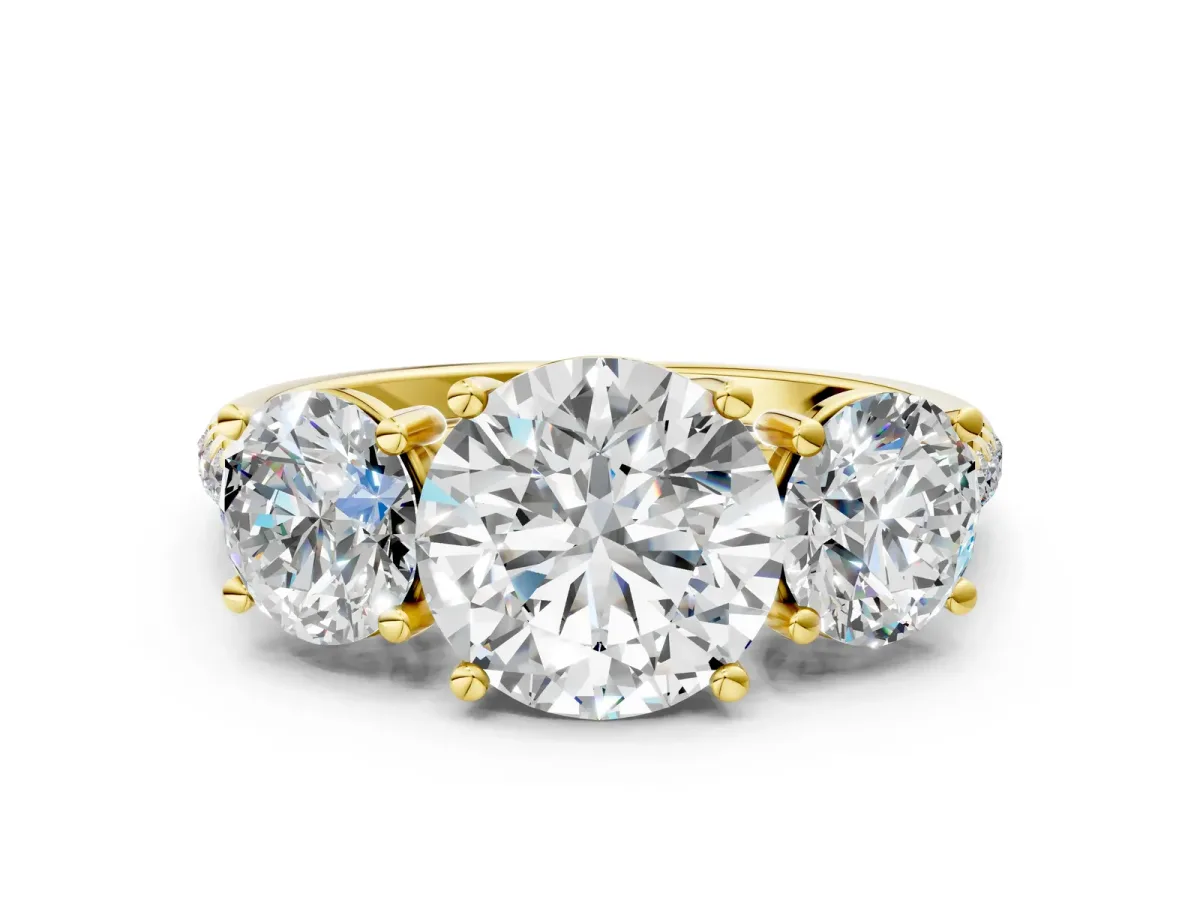 Three-Stone Round Cut Diamond Ring with Round Pavé Band and Prong Setting Yellow gold