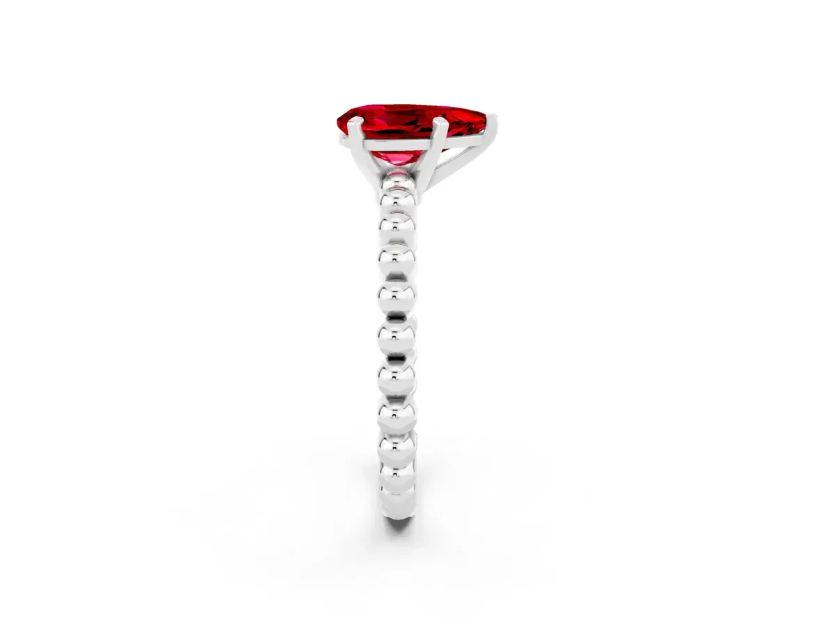 Pear Cut Ruby Solitaire Ring with Beaded Band and Prong Setting White gold