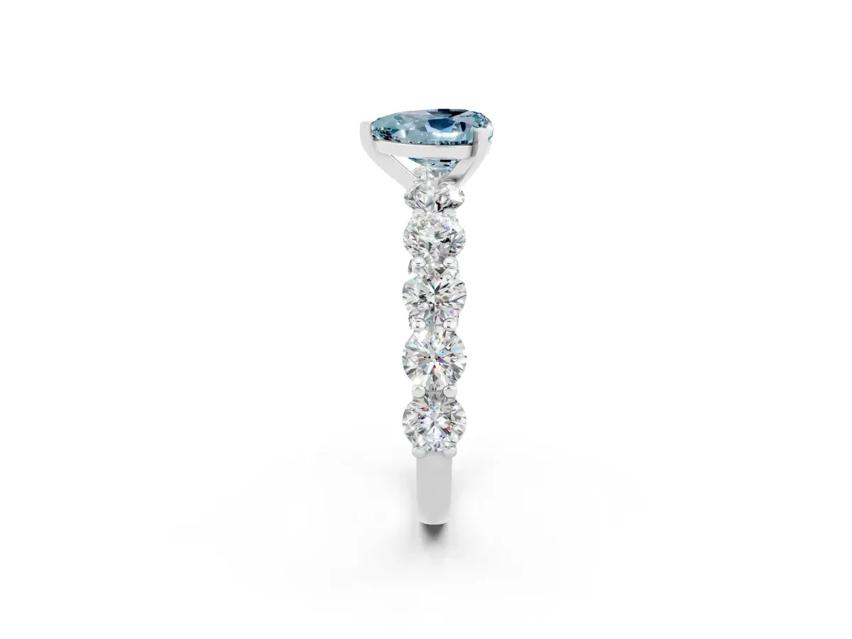 Heart Cut Aquamarine Prong Setting with Side Stones on a Pave Band Silver