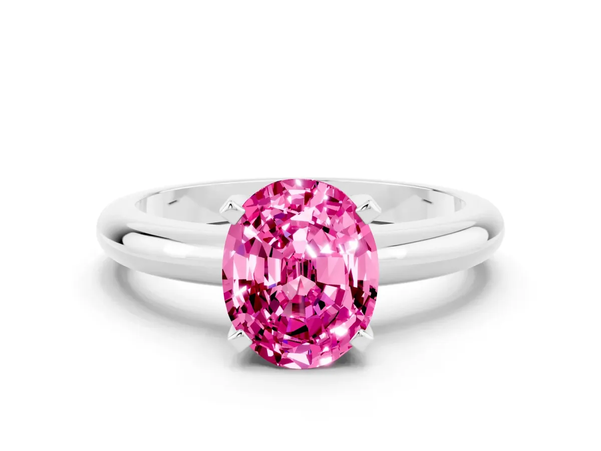 Oval Cut Pink Sapphire Solitaire Engagement Ring with Round Band and Four-Prong Setting Silver
