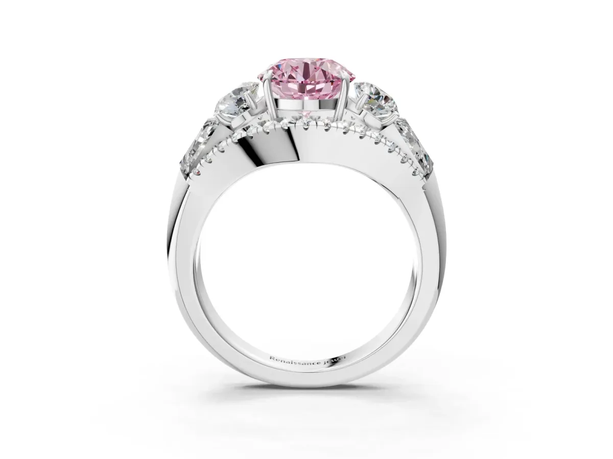 Fancy Pink Three-Stone Round Cut Diamond Engagement Ring with Pave Band and Prong Setting Platinum