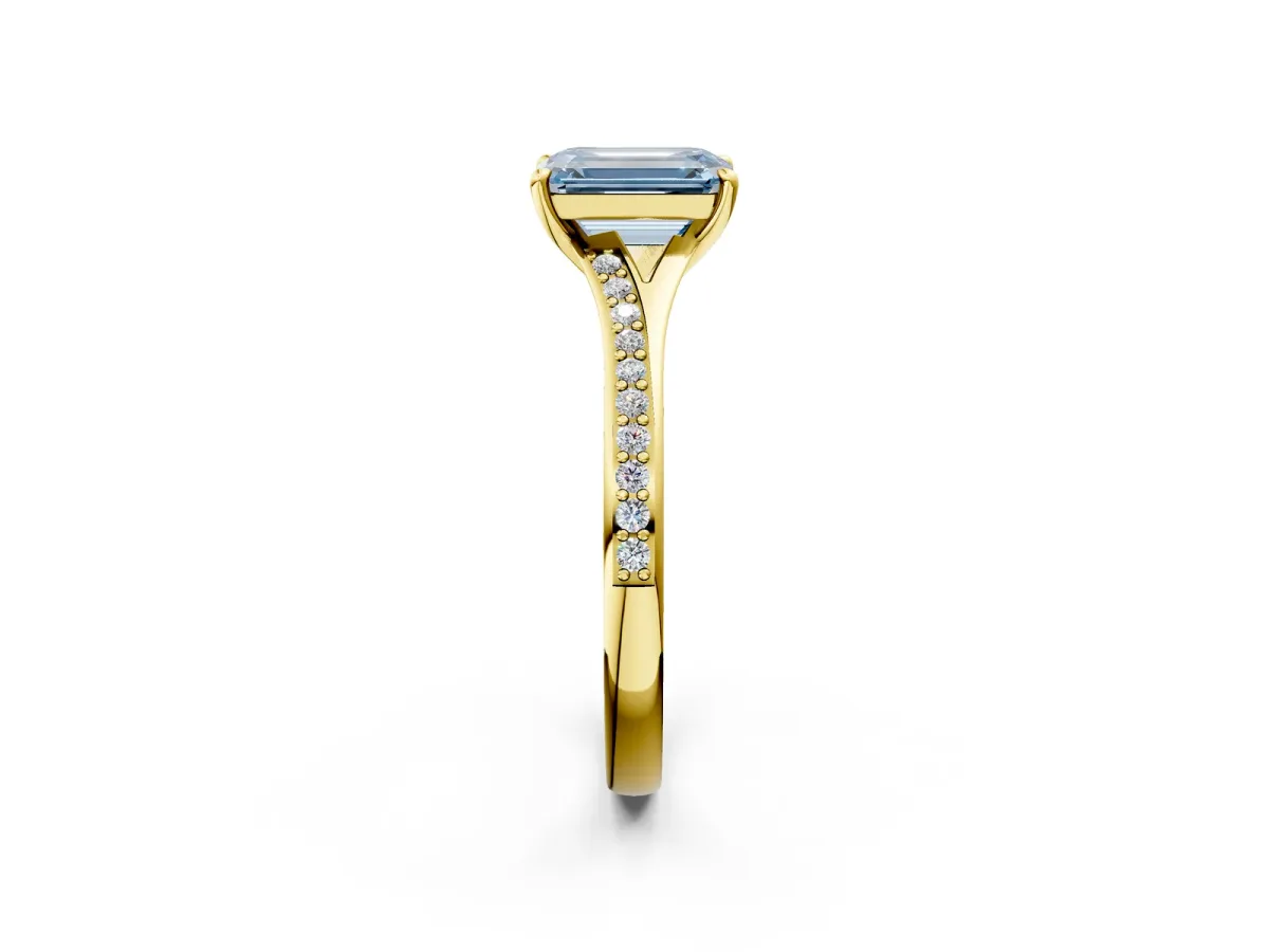 Fancy Blue Emerald Cut Diamond Solitaire Ring with Pavé Band and Prong Setting Yellow gold