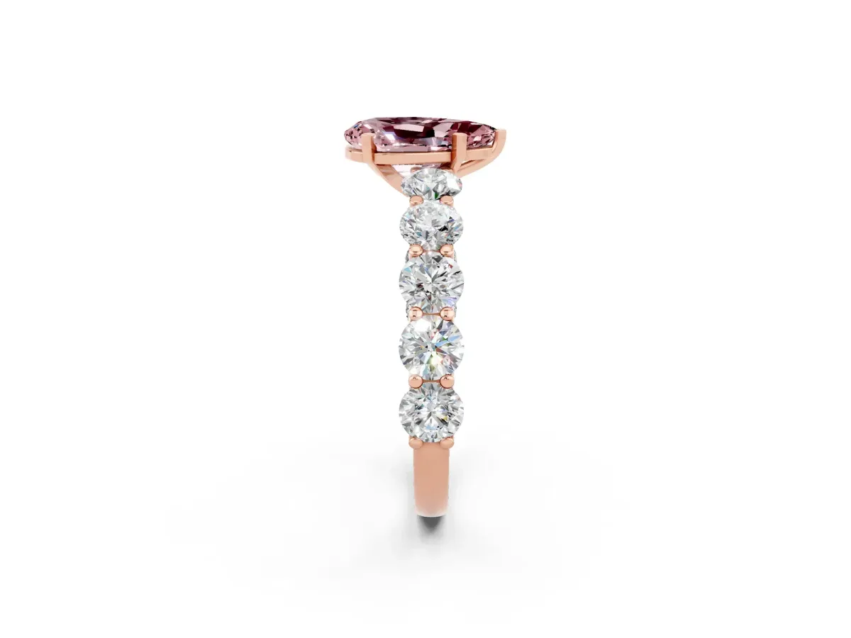 Pear Cut Morganite Prong Setting with Side Stones on a Pave Band Rose gold