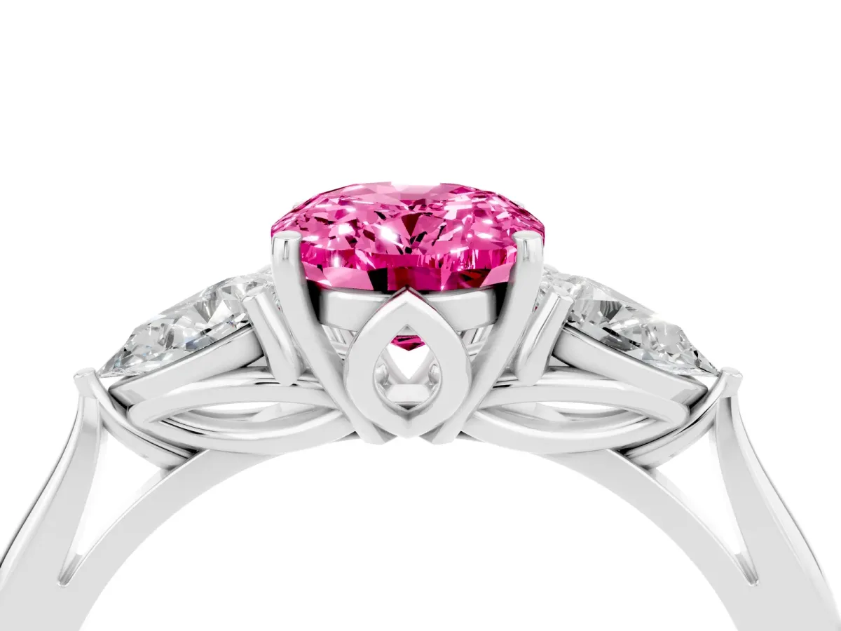 Three-Stone Oval Cut Pink Sapphire Ring with Pear Side Stones in Four-Prong Setting White gold