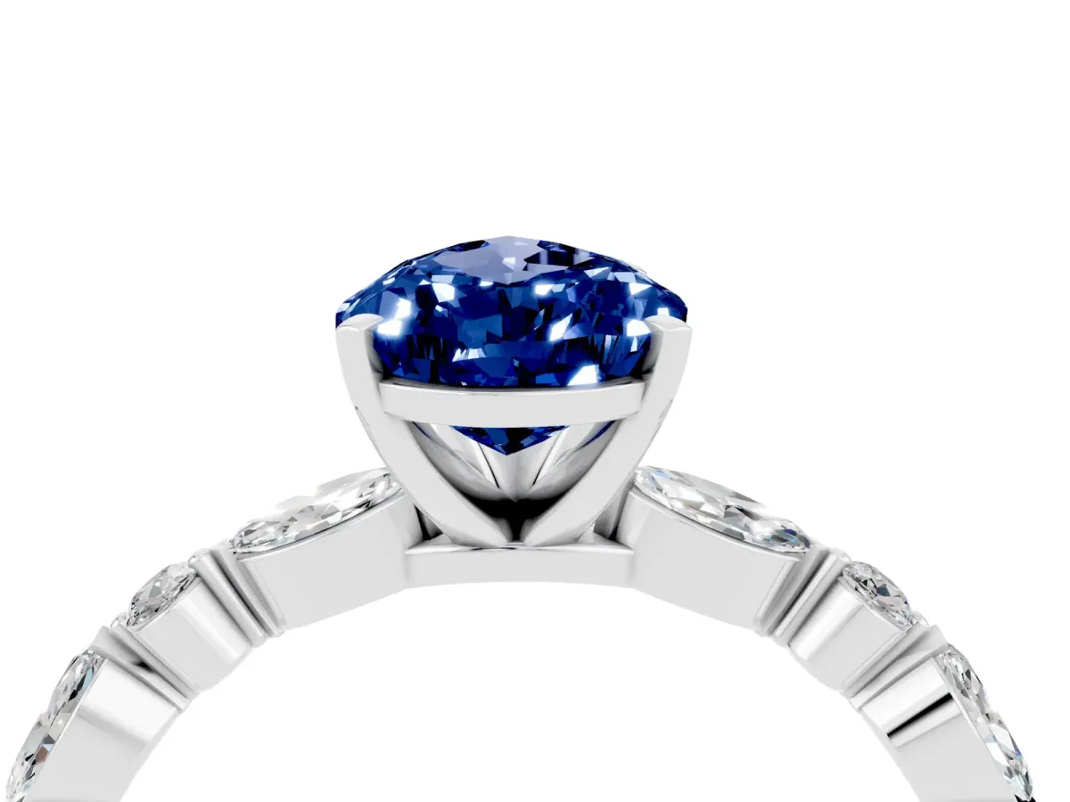 Pear Cut Blue Sapphire Ring with Marquise and Round Side Stones and Four-Prong Setting Silver
