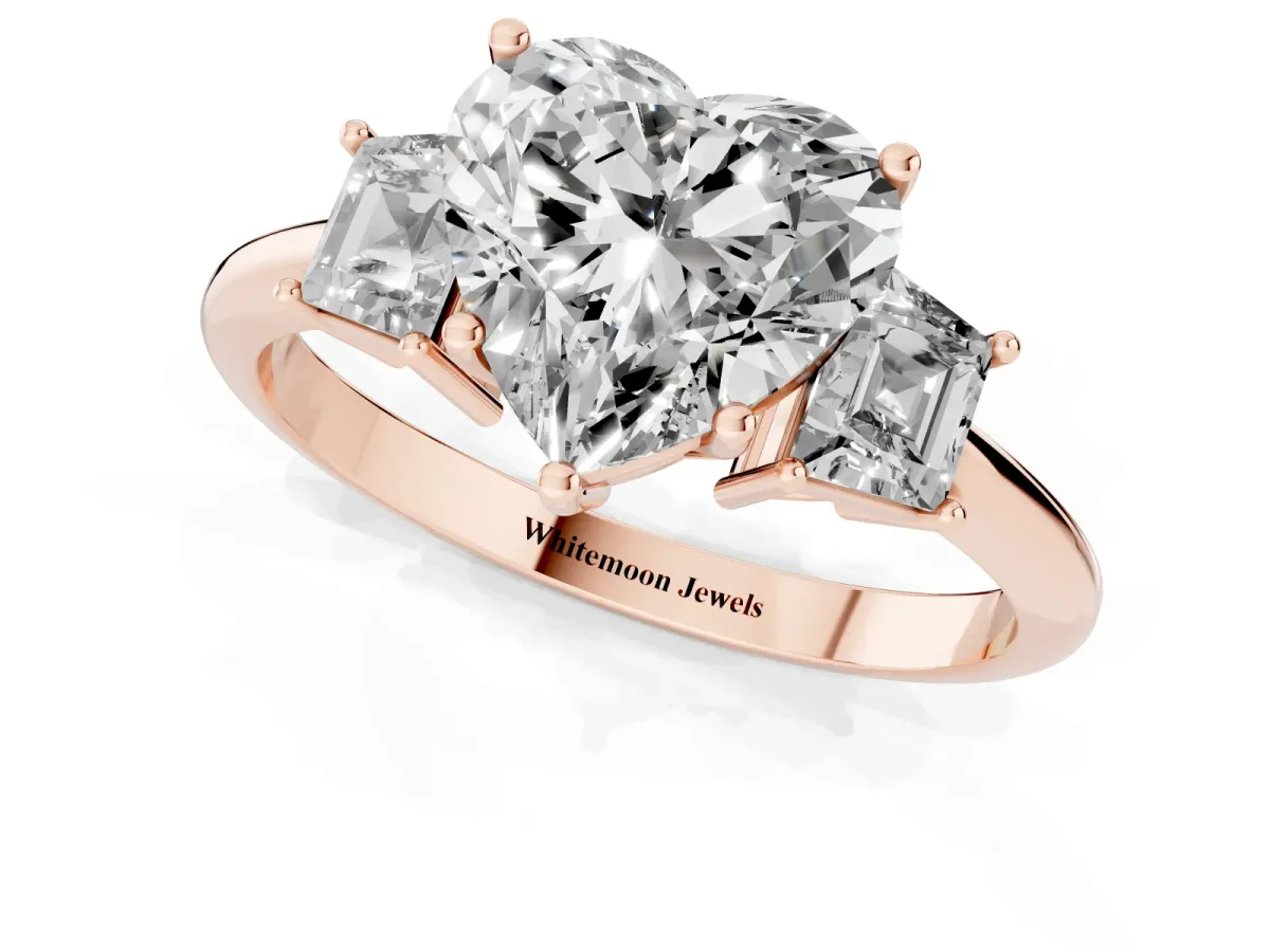 Heart Cut Diamond Three-Stone Ring with Trapezoid Side Stones and Prong Setting Rose gold