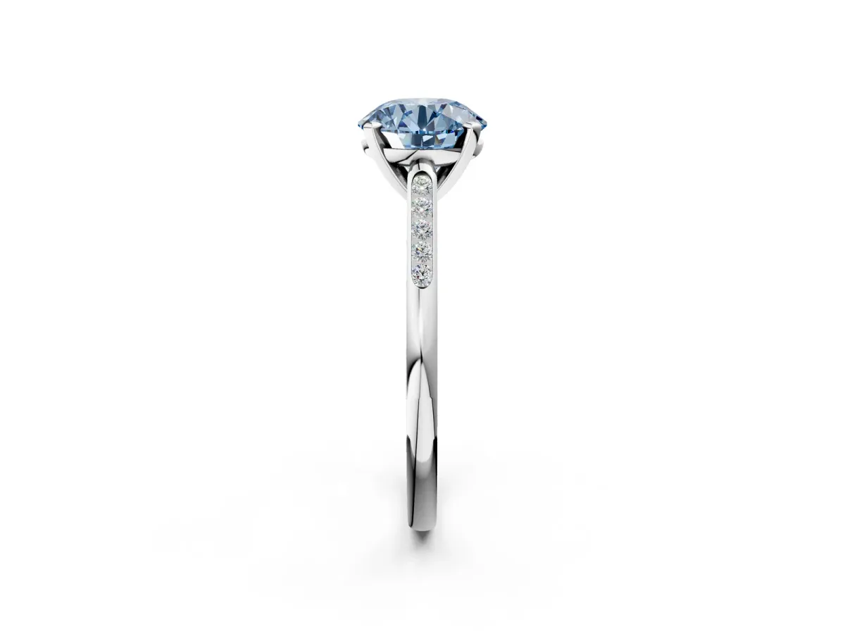 Fancy Blue Round Cut Diamond Solitaire Ring with Channel Set Round Band and Prong Setting Platinum