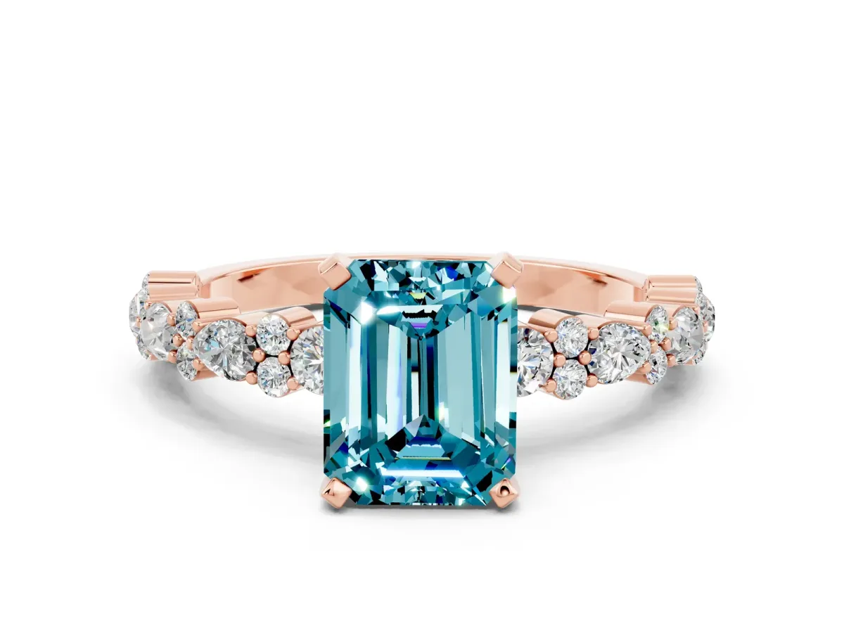 Emerald Cut Blue Topaz Side Stone Solitaire Ring with Round and Four-Prong Setting Rose gold
