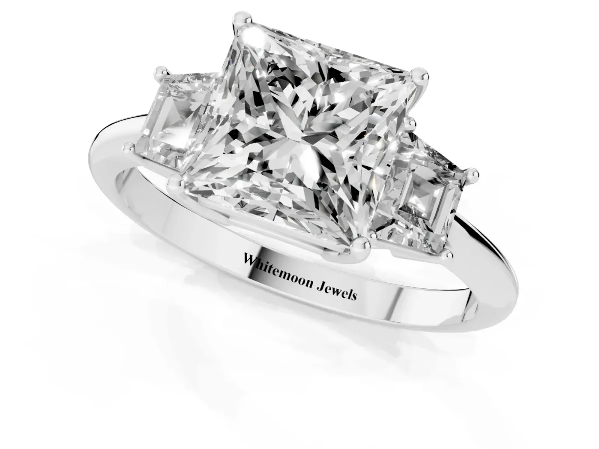 Princess Cut Diamond Three-Stone Ring with Trapezoid Side Stones and Prong Setting Platinum