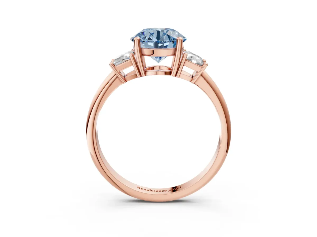 Fancy Blue Round Cut Diamond Three-Stone Ring with Trapezoid Side Stones and Prong Setting Rose gold