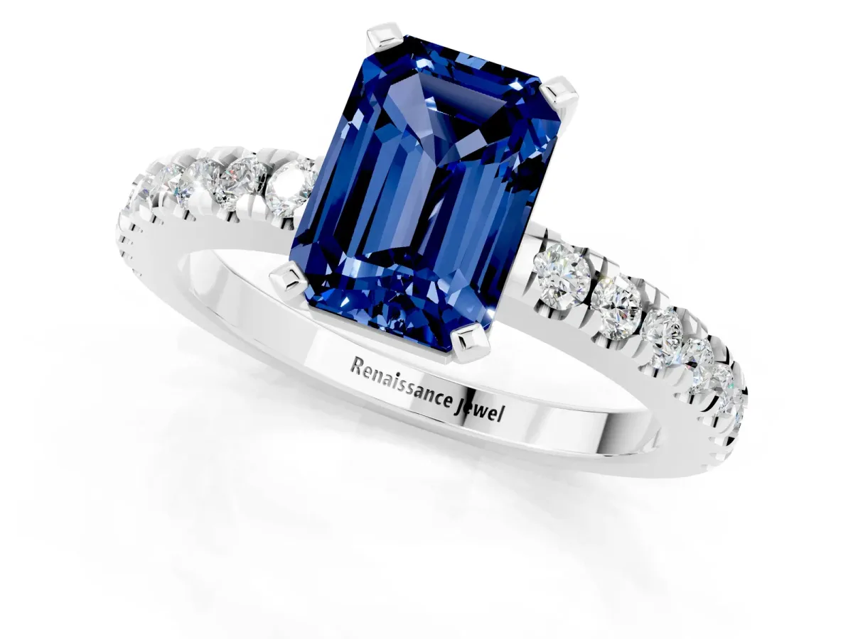 Emerald Cut Solitaire Blue Sapphire with Pavé Band and Four-Prong Setting Silver