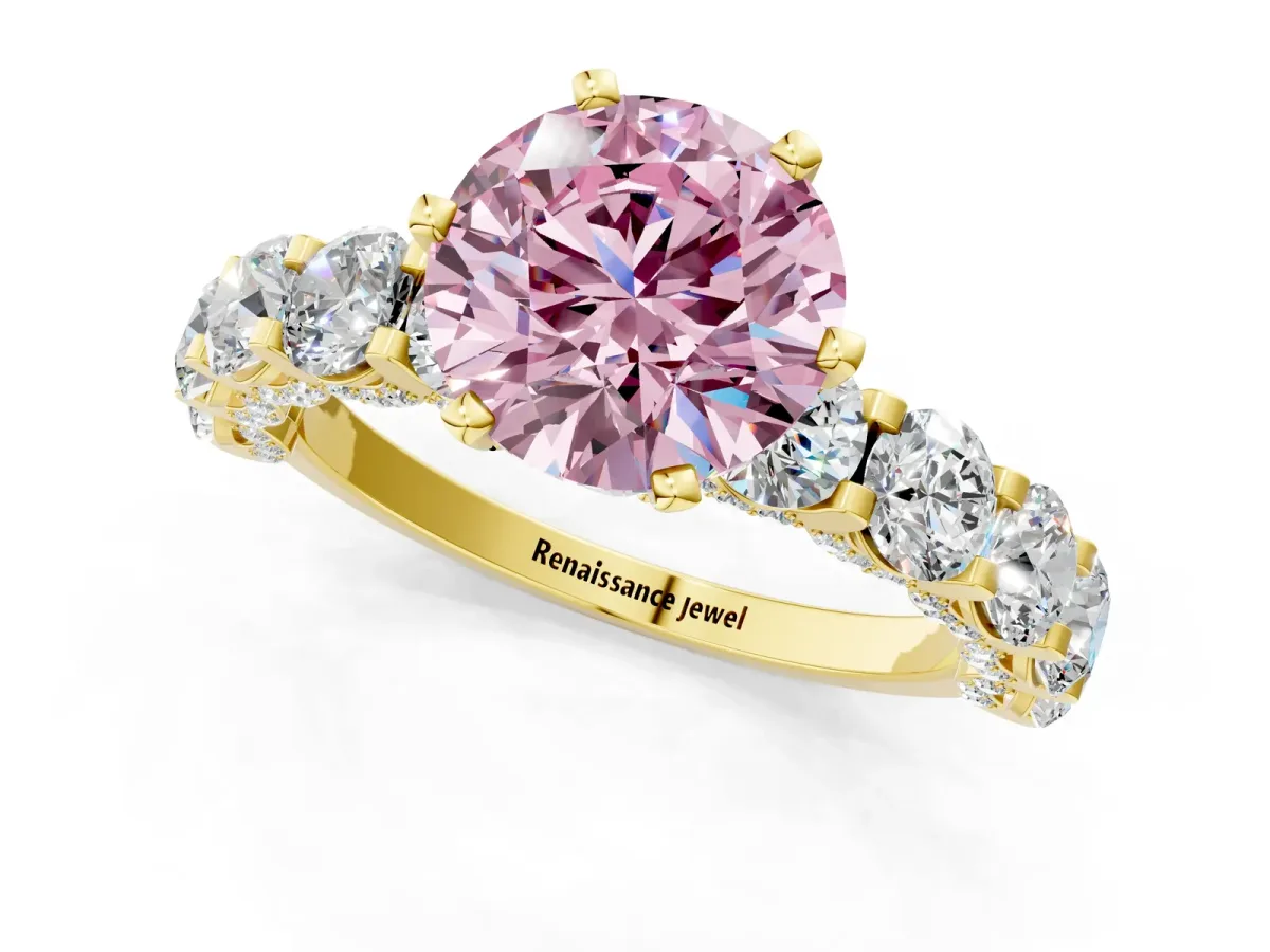 Fancy Pink Round Cut Diamond Side Stone Engagement Ring with Four-Prong Setting Yellow gold