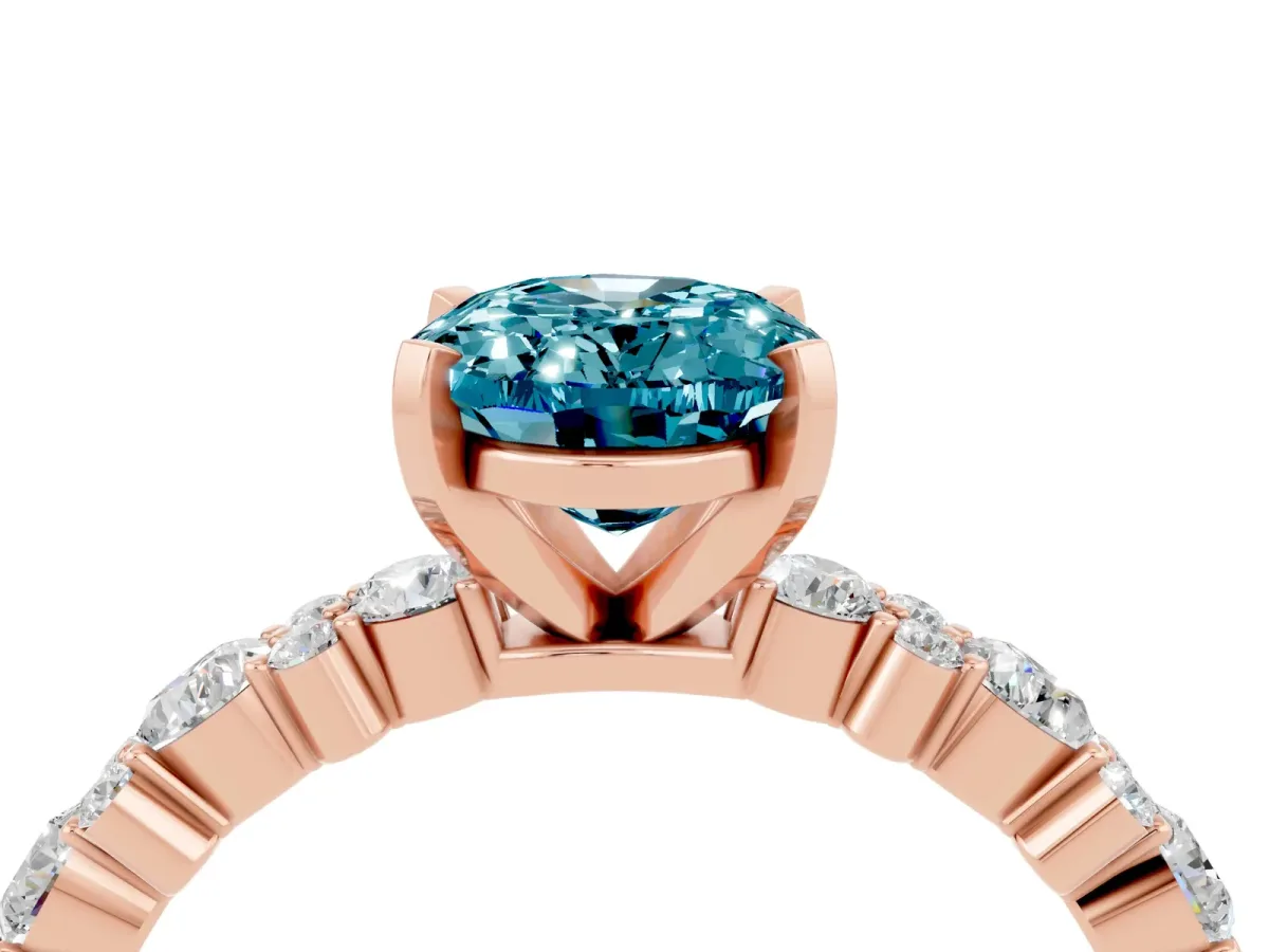 Oval Cut Blue Topaz Side Stone Solitaire Ring with Round and Four-Prong Setting Rose gold