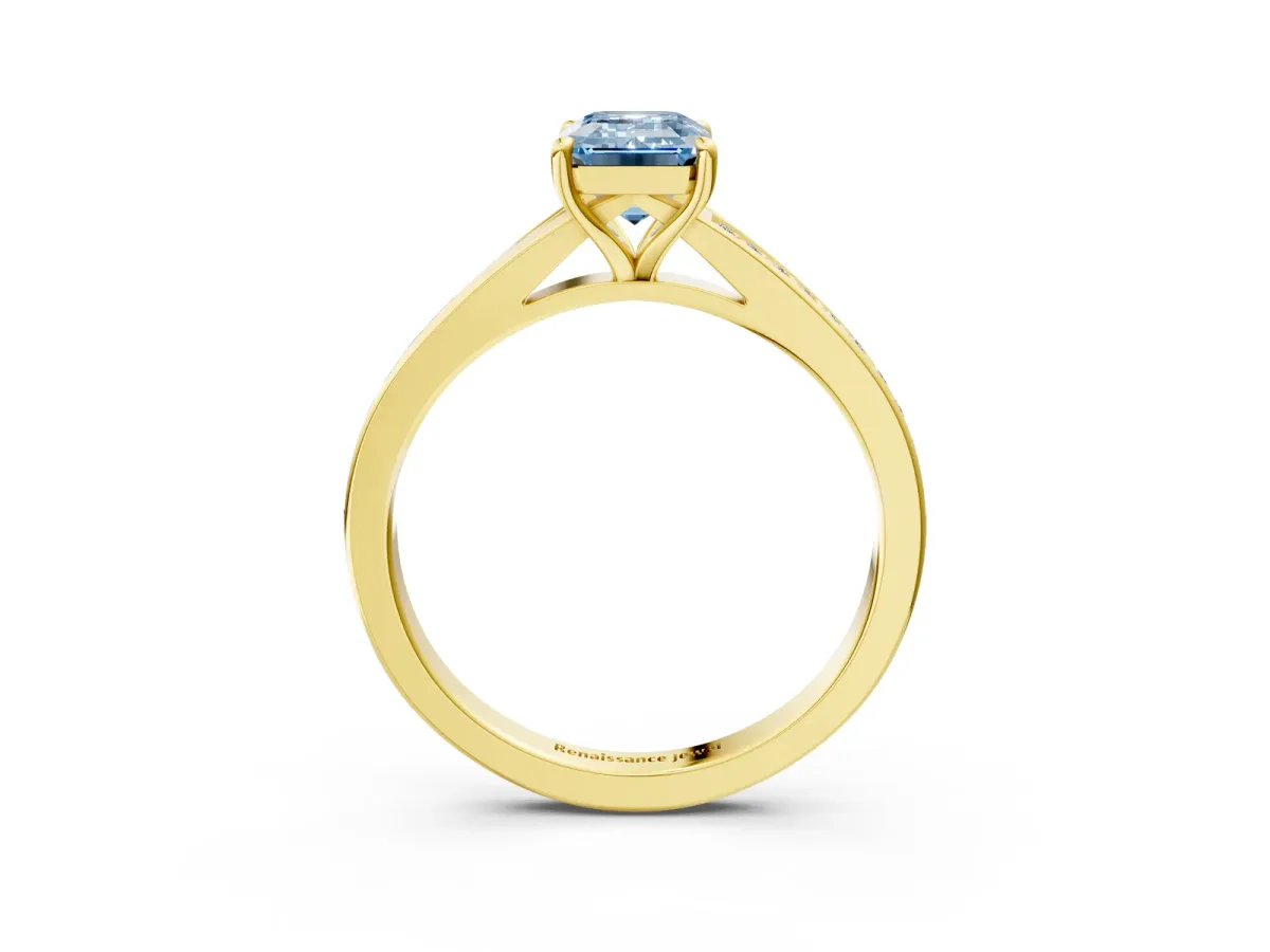Fancy Blue Emerald Cut Diamond Solitaire Ring with Pavé Band and Prong Setting Yellow gold