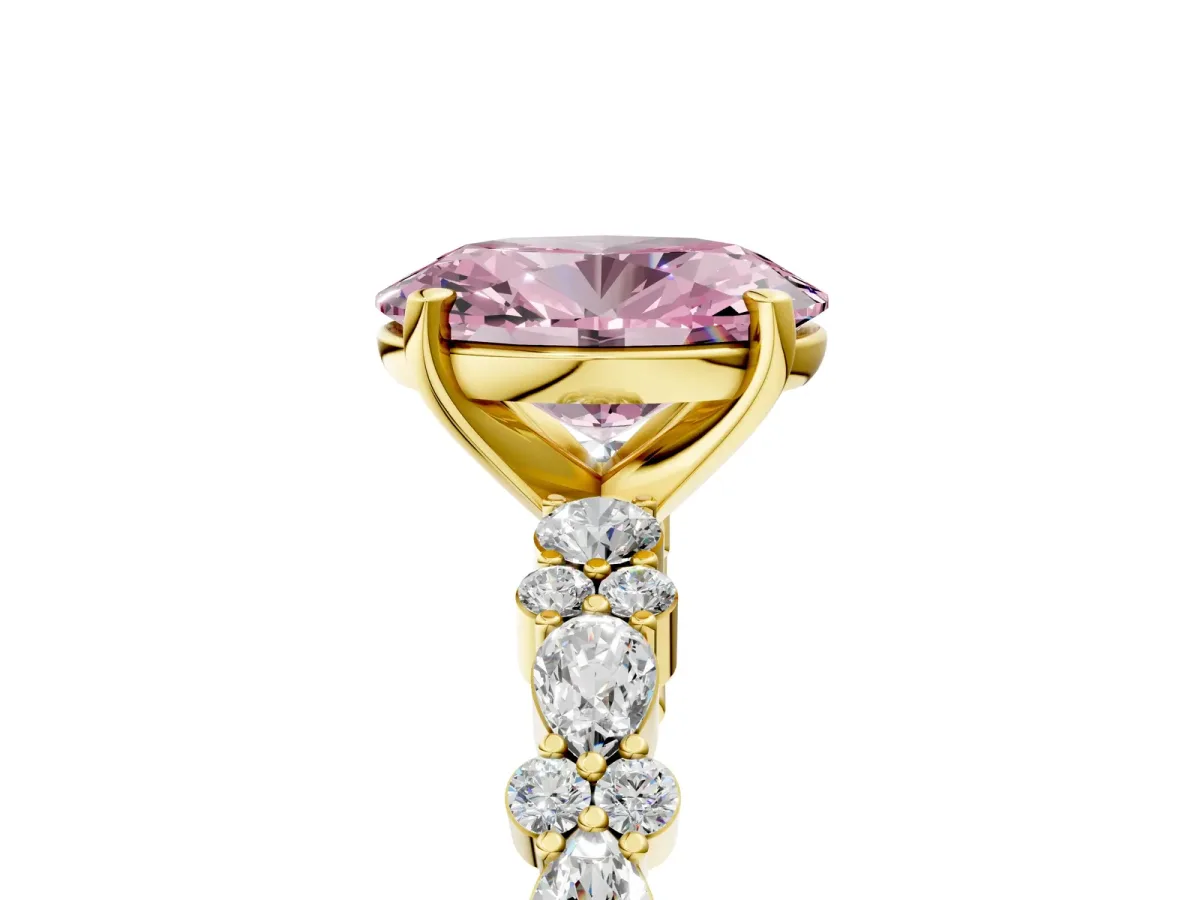 Fancy Pink Oval Cut Diamond Side Stone Solitaire Ring with Round and Four-Prong Setting Yellow gold