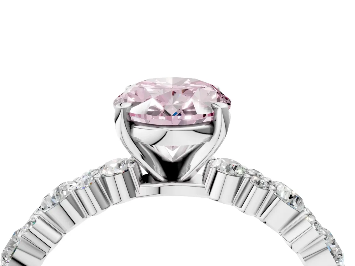 Fancy Pink Oval Cut Diamond Side Stone Solitaire Ring with Round and Four-Prong Setting Platinum