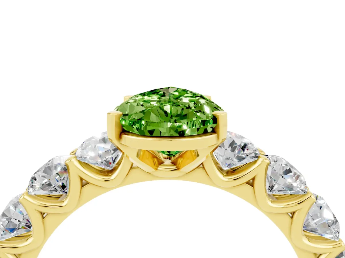 Pear Cut Peridot Prong Setting with Side Stones on a Pave Band Yellow gold