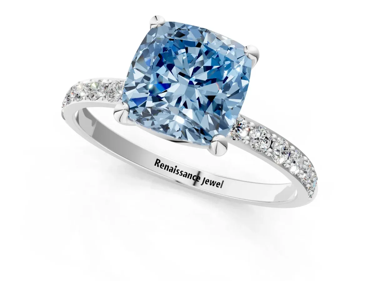 Fancy Blue Cushion Cut Diamond Solitaire Ring with Round Pavé Band and Prong Setting Platinum