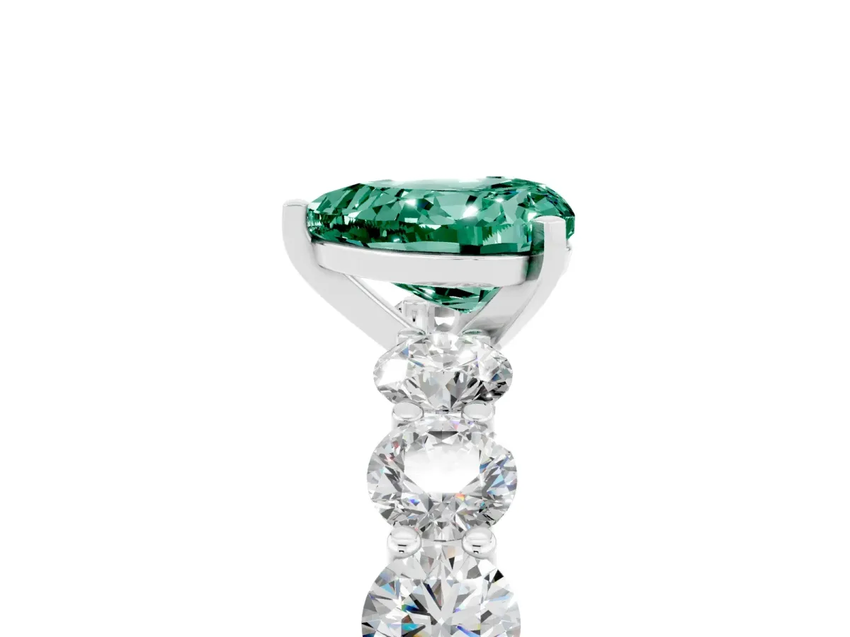 Heart Cut Green Sapphire Prong Setting with Side Stones on a Pave Band Silver