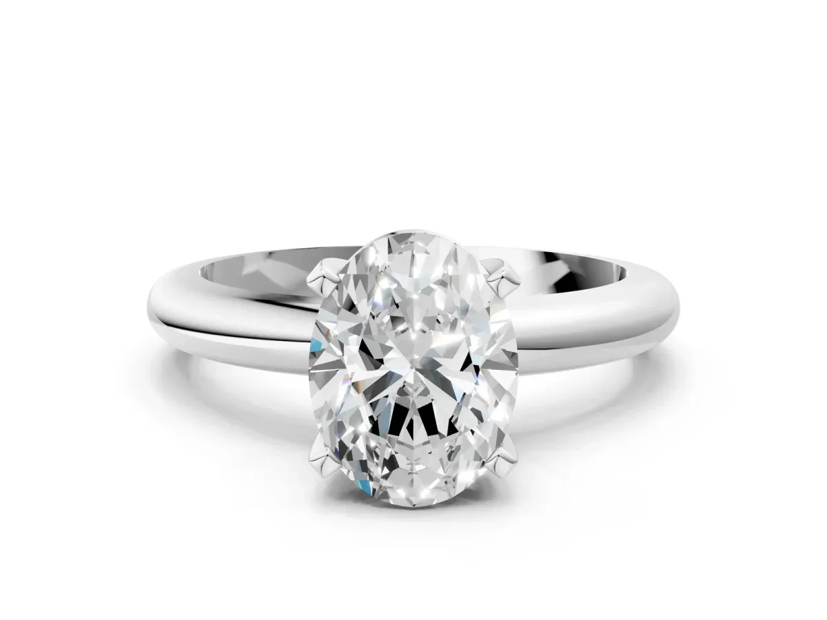 Oval Cut Diamond Solitaire Engagement Ring with Round Band and Four-Prong Setting Silver