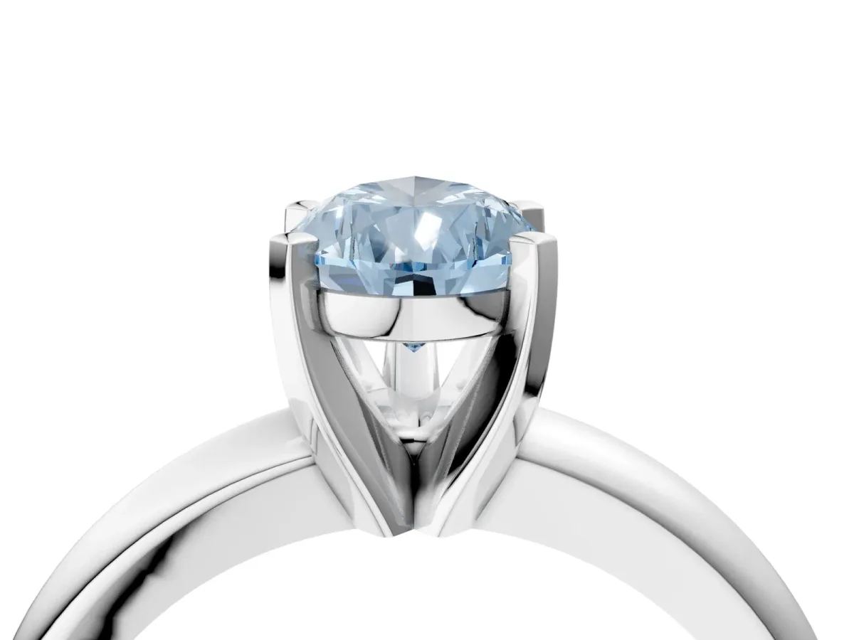 Fancy Blue Pear Cut Diamond Solitaire Engagement Ring with Round Band and Four-Prong Setting Silver