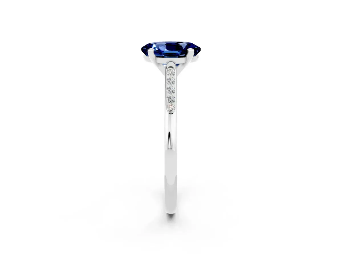 Oval Cut Blue Sapphire Solitaire Ring with Channel Set Round Band and Prong Setting Silver