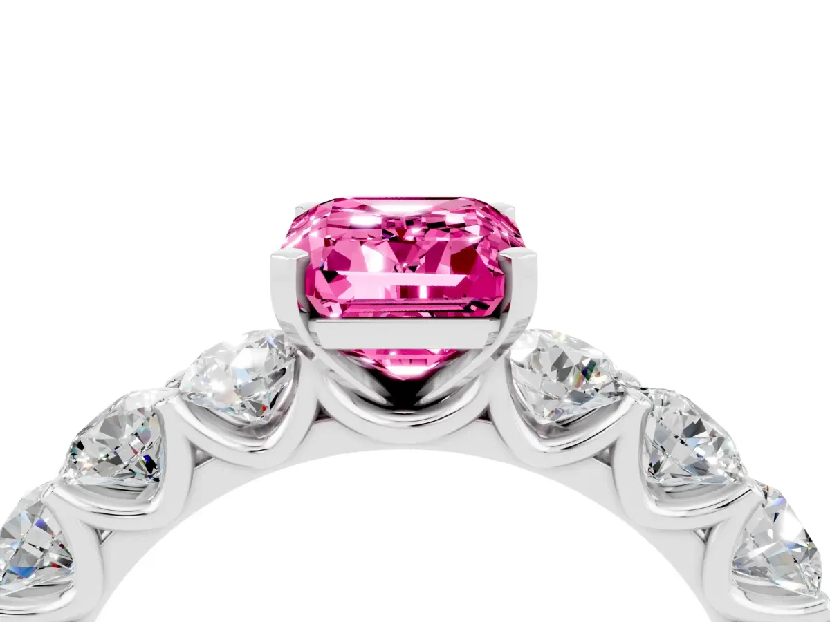 Emerald Cut Pink Sapphire Prong Setting with Side Stones on a Pave Band Silver