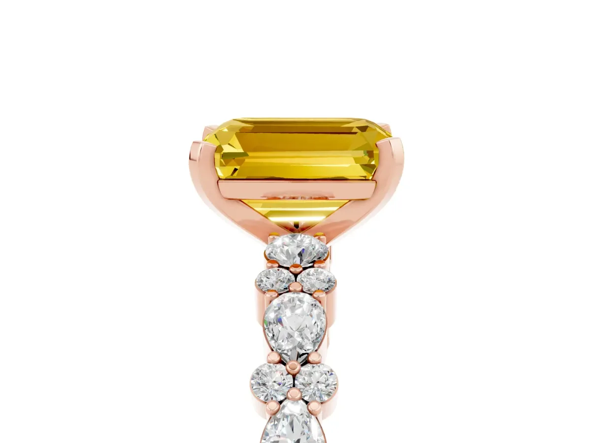 Emerald Cut Yellow Sapphire Side Stone Solitaire Ring with Round and Four-Prong Setting Rose gold