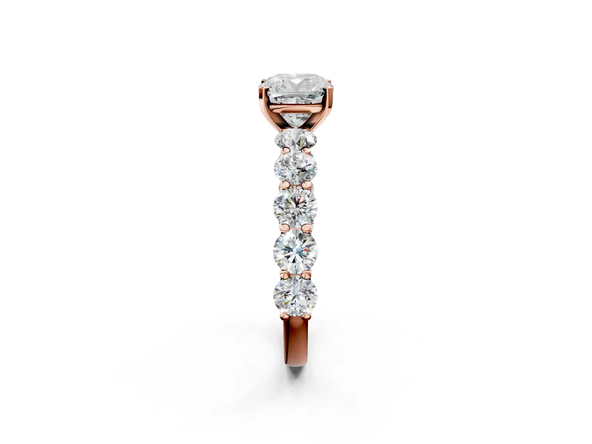 Cushion Cut Diamond Prong Setting with Side Stones on a Pave Band Rose gold
