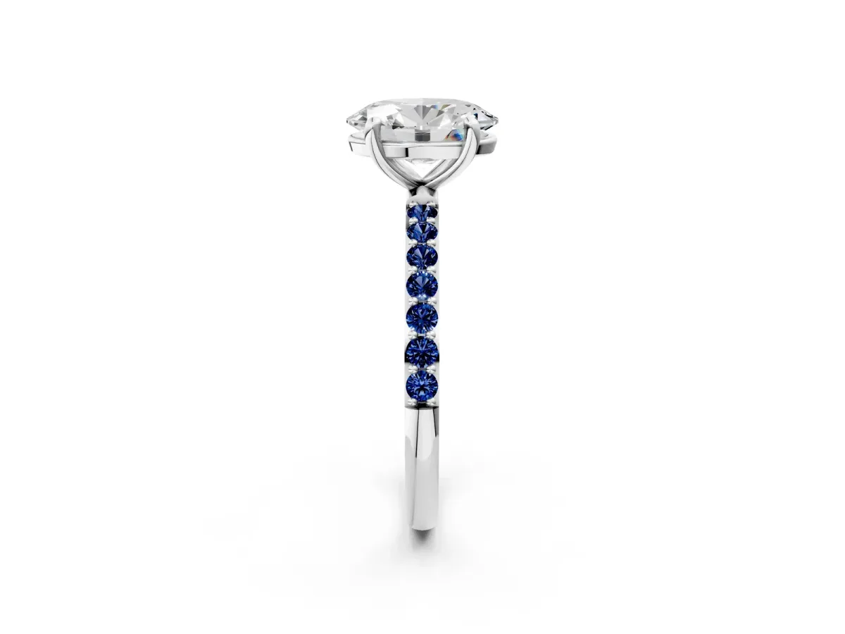 Oval Cut Diamond Solitaire Ring with Round Blue Sapphire Pavé Band and Prong Setting Silver