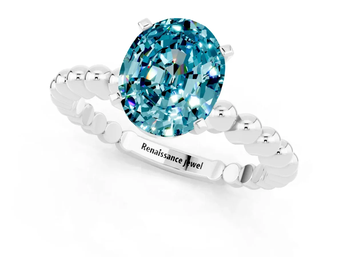 Oval Cut Blue Topaz Solitaire Ring with Beaded Band and Prong Setting Silver