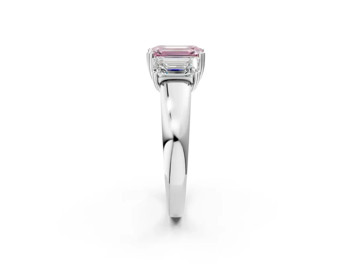 Fancy Pink Three-Stone Emerald Cut Cut Diamond Ring with Channel Set Band and Four-Prong Setting Platinum