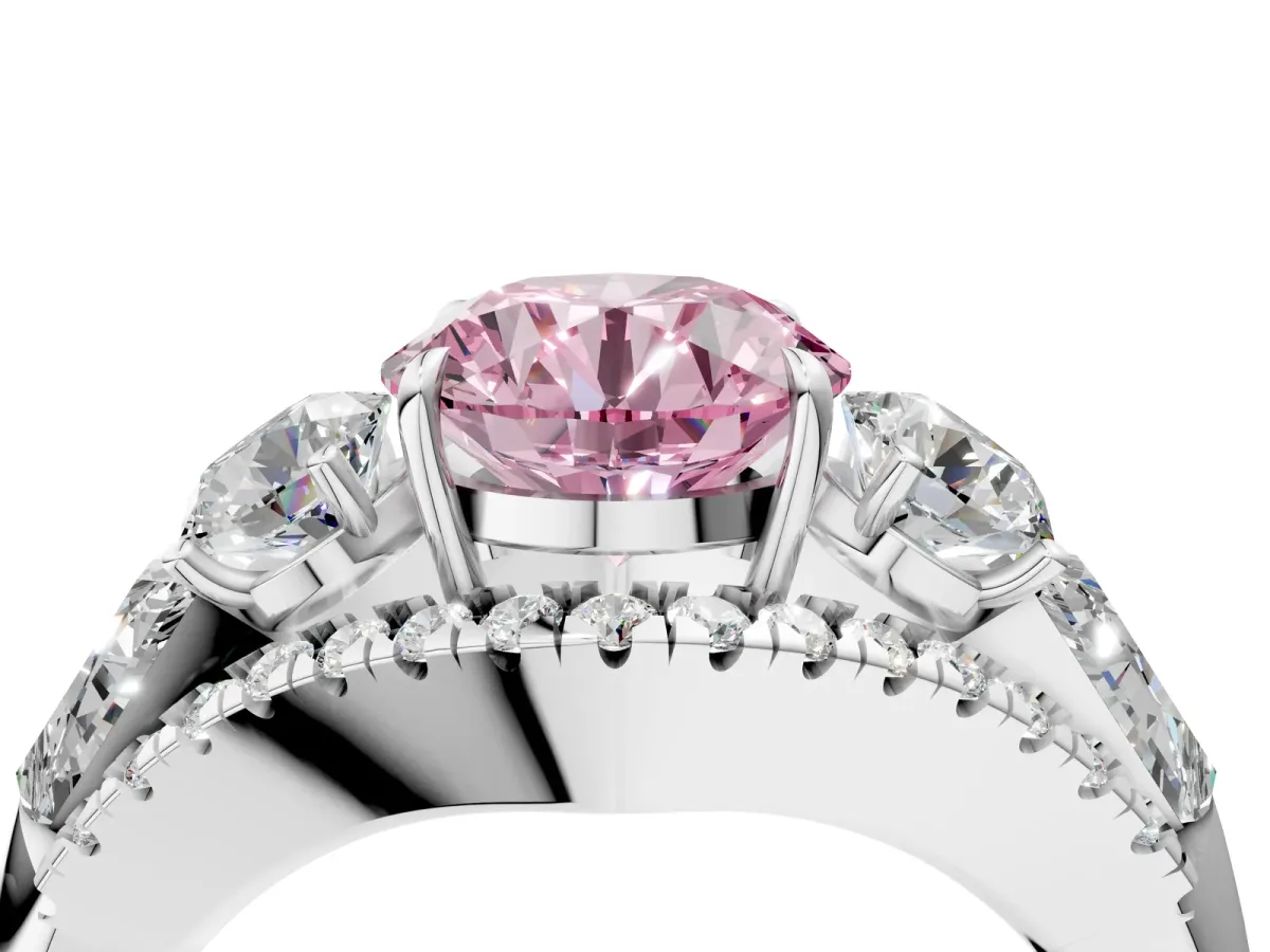 Fancy Pink Three-Stone Round Cut Diamond Engagement Ring with Pave Band and Prong Setting Platinum